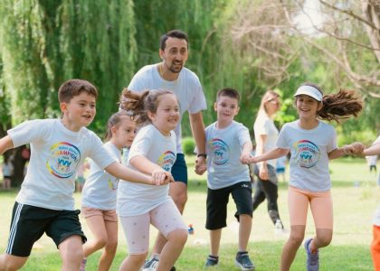 a group of young children playing a game of frisbee